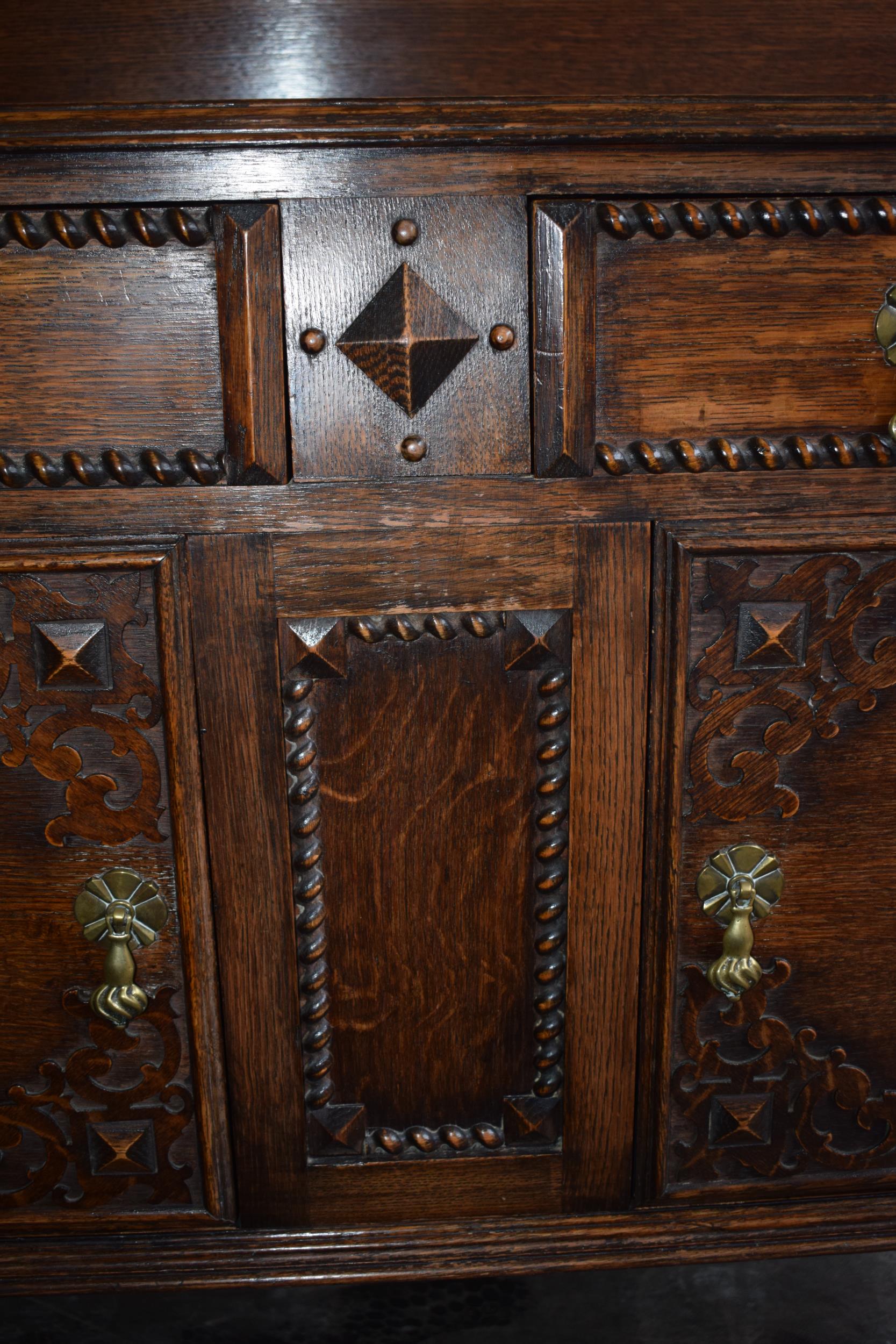 1930s oak sideboard with carved decoration with drawers and cupboards, 153x51x107cm tall. In good - Image 7 of 9