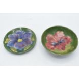 Moorcroft items in the Hibiscus design to include a shallow bowl and a pin tray, 12cm diameter (