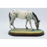 Boxed Royal Doulton Appaloosa RDA32 on wooden plinth. In good condition with no obvious damage or
