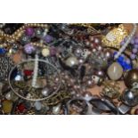 A large and varied collection of costume jewellery to include bangles, bracelets, necklaces, chain