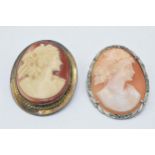 A pair of silver framed cameo brooches, one with marcasites (2).