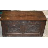 19th century oak coffer with carved decoration to the front and panelled sides, 99x48x45cm tall.