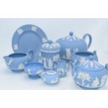 Wedgwood Jasperware in Blue: to include a teapot,milk, lidded sugars, trinket and miniatures .