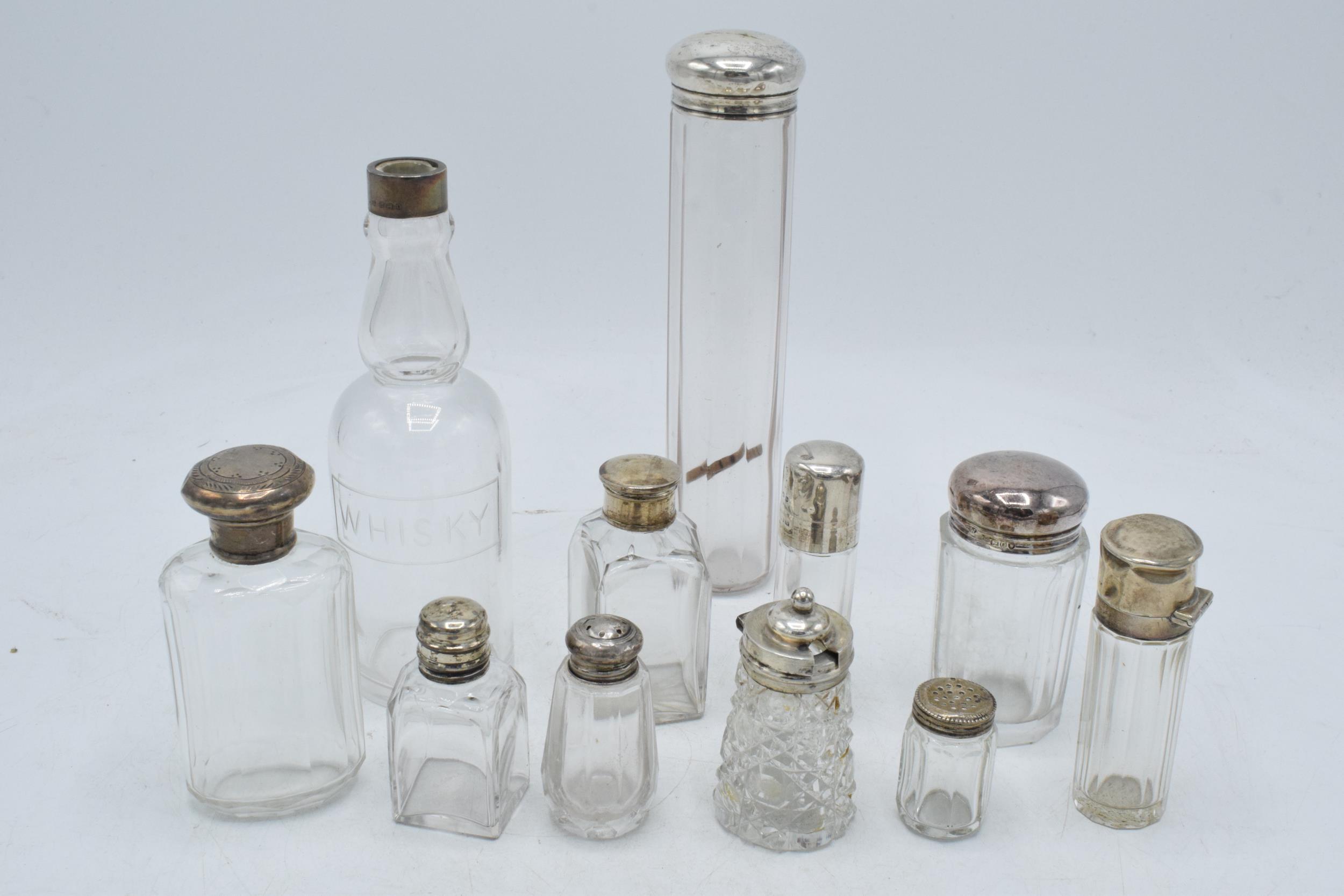 A collection of hallmarked silver topped glass containers to include cruets, perfume and others ( - Image 2 of 5