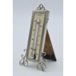 Silver easel-back thermometer with ornate supports, Birmingham 1922 'LE', 10cm tall.