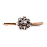 Victorian 9ct gold bar brooch set with old cut diamonds in the form of a flower, 3.9 grams, 34mm