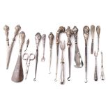 A good collection of silver-handled items to include scissors, knives, button hooks etc (Qty).