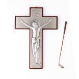 A silver fronted INRI crucifix scene of Jesus on his cross together a novelty golf club with