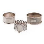 A trio of silver napkin rings to include Birmingham 1917, Emile Viner of Sheffield, and Birmingham