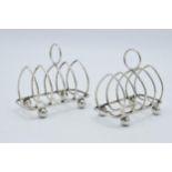 A pair of silver heart-shaped toast racks with room for 4 slices, both Sheffield 1891, Walker and