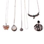 A collection of silver necklaces each with pendants to include Mother of Pearl and others (5).