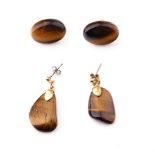 A pair of yellow metal tiger's eye earrings together with a similar pair (2 pairs).