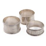 A trio of silver napkin rings to include William Thorneymark Birmingham 1900, Robert Pringle &