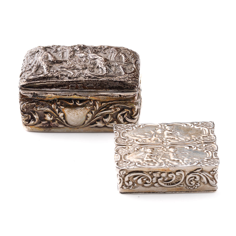 A pair of silver trinket boxes, both with embossed decoration, the larger being Birmingham 1900, the