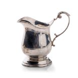 Silver cream jug on pedestal base, Sheffield 1943, 115.3 grams, 10cm tall.