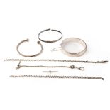 A collection of silver jewellery to include a silver hollow hinged bangle, a torque bangle, part
