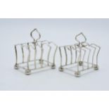 A pair of silver toast racks with each having space for 4 slices, Birmingham 1925, Adie Bros, 73.0