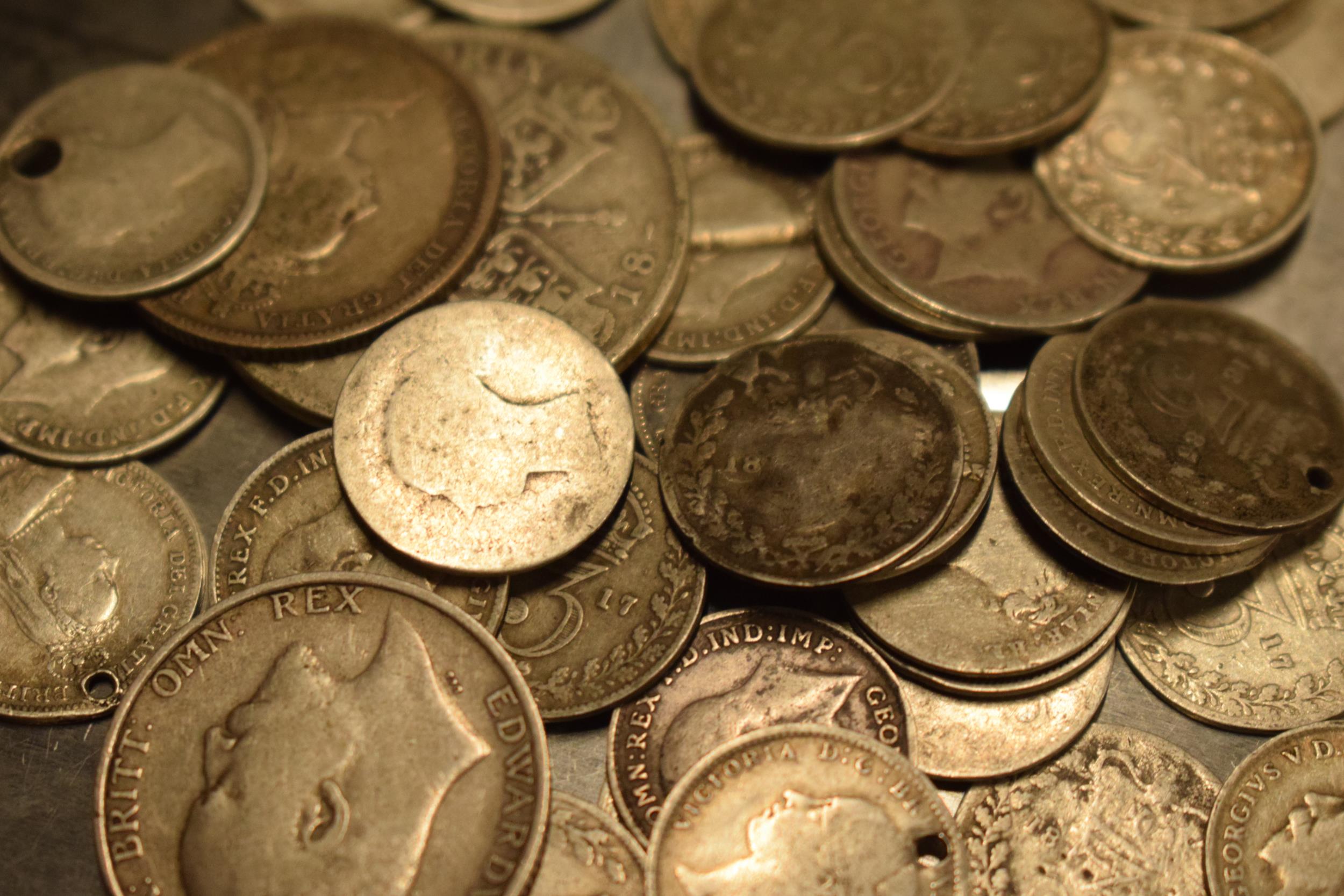 A collection of pre-1920 silver coinage of varying denominations, approx. 75+ grams. Condition