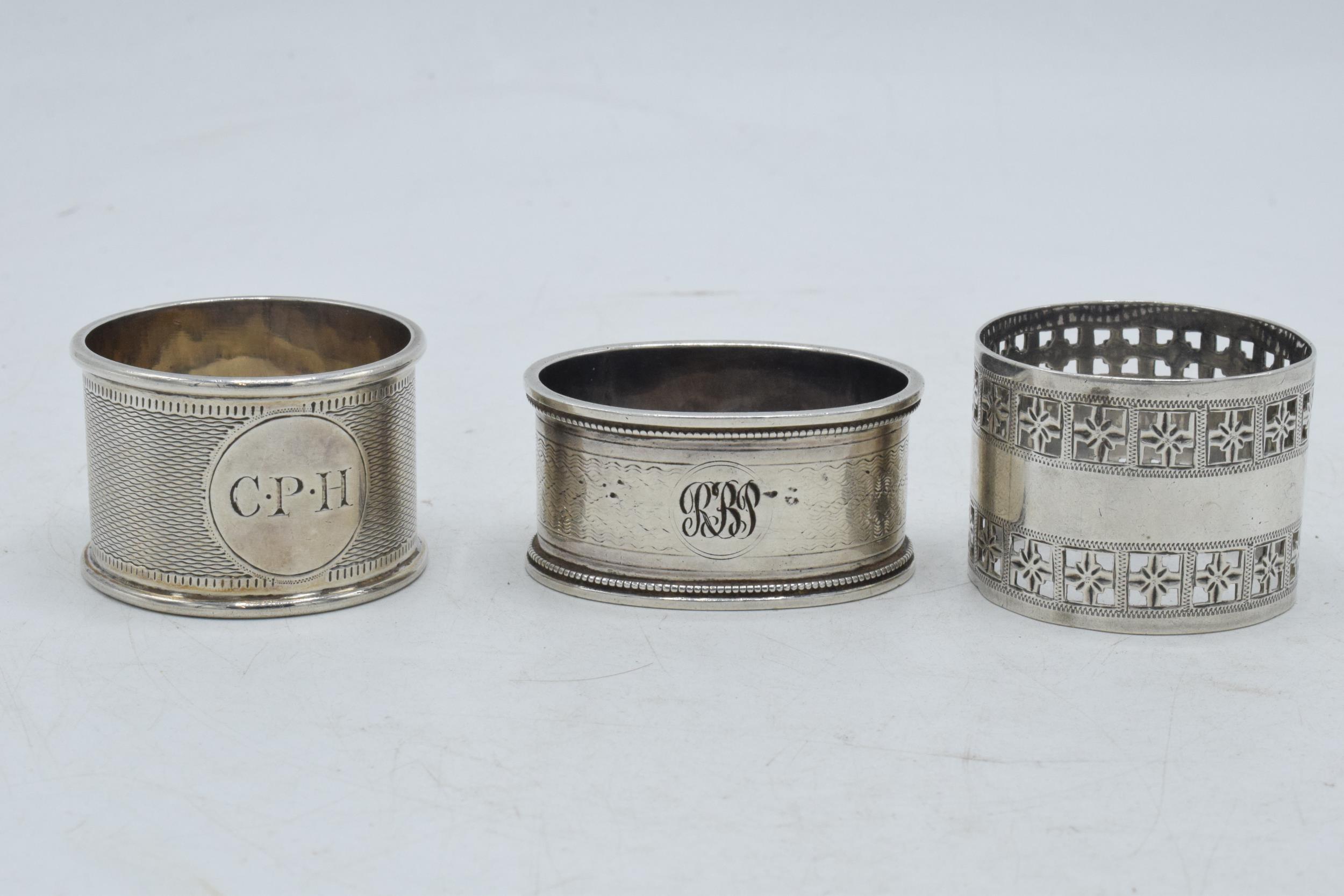 A trio of silver napkin rings of varying designs to include Martin, Hall & Co Sheffield 1881, - Image 2 of 3