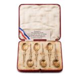A cased set of 6 silver gilt tea spoons, 57.2 grams, Birmingham 1936, 'Facisimile of the Anointing