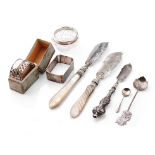 A collection of silver items to include a pair of silver and Mother of Pearl handled fish knives,