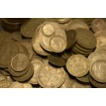 A large collection of 1920-1946 silver coinage of varying denominations, approx 1040+ grams.