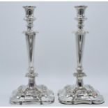 A pair of silver plated large candlesticks with embossed floral decoration, 31.5cm tall (2). Some