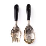 A pair of early to mid 20th century lower grade silver salad servers with ebonised wooden handles,