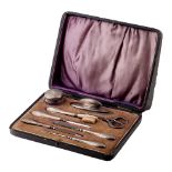 Silver handled manicure set with 8 pieces to include a nail buffer, lidded jar, nail file and others