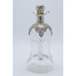 Victorian silver 'glug glug' decanter with ornate silver overlay and silver handled stopper,