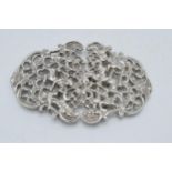 Silver ornate belt buckle, London 1979, 59.2 grams, 9cm wide.