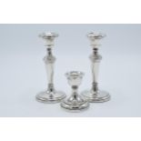 A near pair of hallmarked silver candlesticks, made by W I Broadway & Co, Birmingham 1984 and