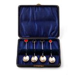 A set of 4 hallmarked silver tea spoons, handles decorated with enamelled card suits, Birmingham