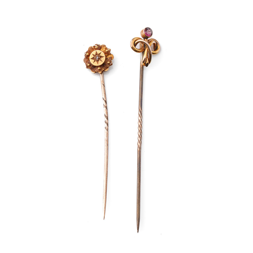 A pair of 9ct gold (tests as 9ct or better) stick pins, one set with amethyst, the other with