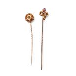 A pair of 9ct gold (tests as 9ct or better) stick pins, one set with amethyst, the other with