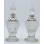 A near pair of silver and cut glass perfume bottles, one London 1904, the other London 1926, both by