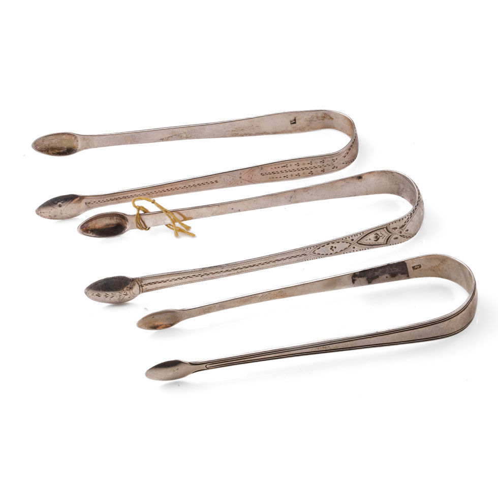 A trio of Georgian sugar tongs, one with bright cut decoration and 2 similar, 92.7 grams (3).