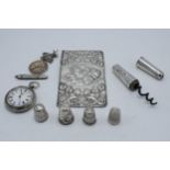 A collection of silver items to include a sterling silver cased corkscrew, a silver Reynold's Angels