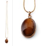 9ct gold chain with a 9ct gold tiger's eye pendant, 6.3 grams, chain 50cm long.