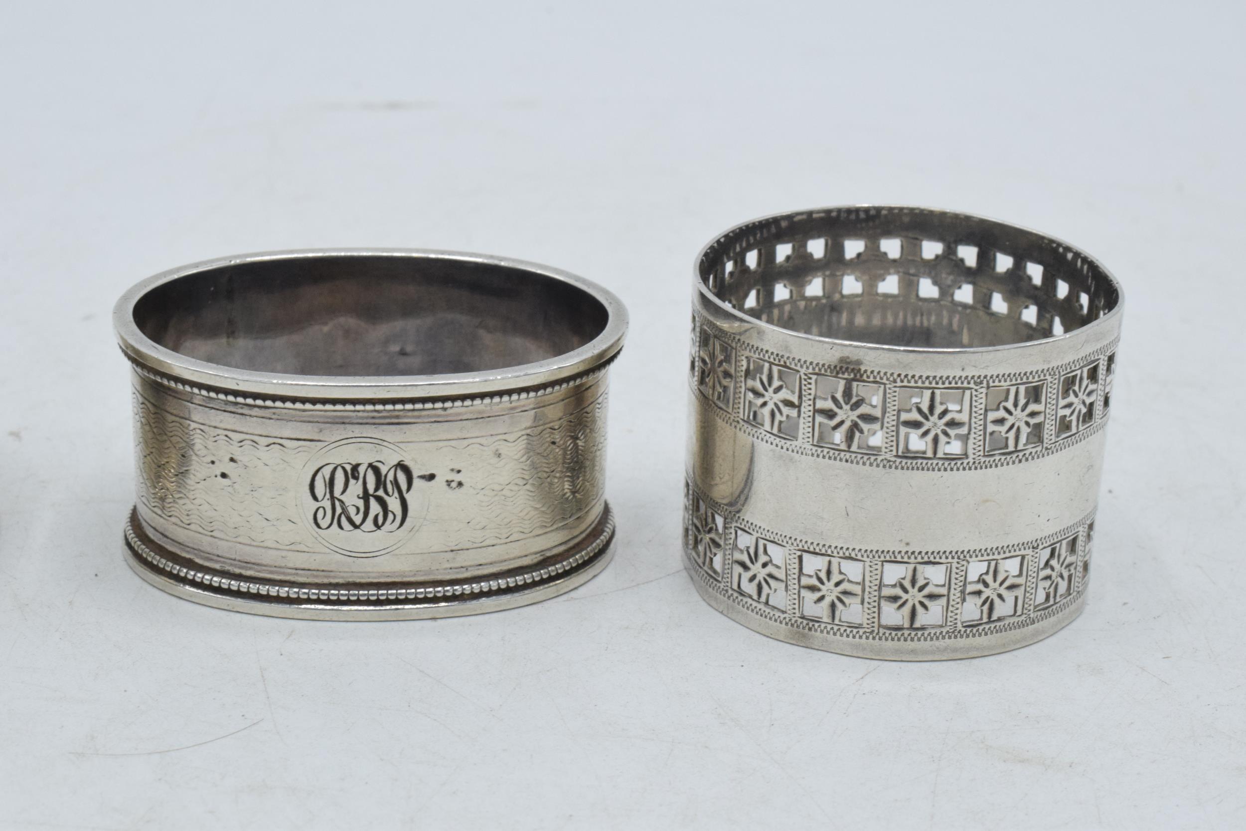A trio of silver napkin rings of varying designs to include Martin, Hall & Co Sheffield 1881, - Image 3 of 3