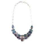 A chunky silver ladies necklace set with abalone panels, 14cm wide.