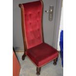 French high backed low chair with upholstered decoration, 102cm tall.