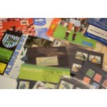 A collection of UK stamps from early to mid 20th century together with later football programmes (