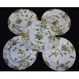 A group of 5 18th century faience ware plates with floral designs and indistinct signature to