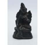 Antique bronze cast figure of an oriental figure, 11cm tall. In good condition, some holes to rear.