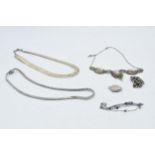 A collection of silver jewellery to include a cameo necklace and other similar, a locket and others,