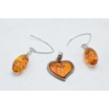 A pair of silver and amber style earrings with a heart shaped pendant (3).