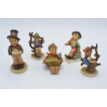 A collection of Goebel / Hummel figures to include Let's Sing, Merry Wanderer, Apple Tree Boy, Apple