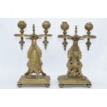 A pair of early 20th century Eastern brass ornate freestanding sconces, 32cm tall (2).