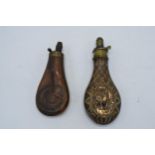 A pair of 19th century copper and brass powder flasks with repousse decoration with basket weave and